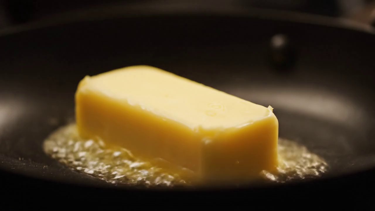Visual: Close-ups of sizzling butter, caramelized ...