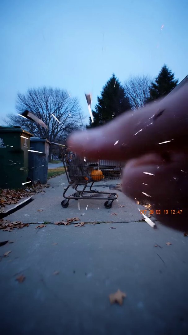 Old miniDV handycam vibe: suburban driveway at dus...