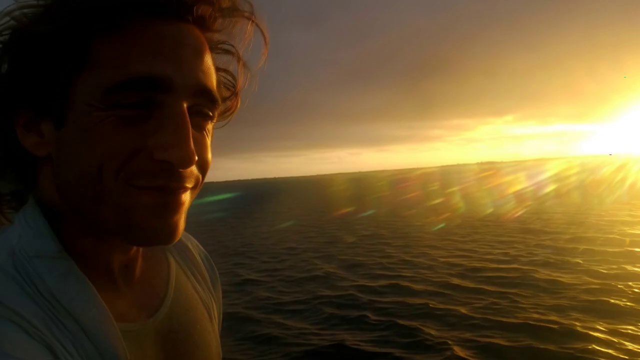 He keeps his gaze fixed directly on the camera fro...
