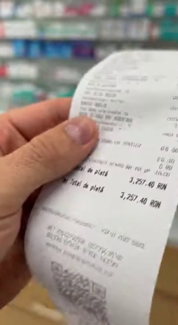 [Sora 2] Indoor pharmacy receipt close-up. Man looks shocked and says: «Bine că am asigurare de sănătate… că ... - Veo 3 AI video prompt thumbnail