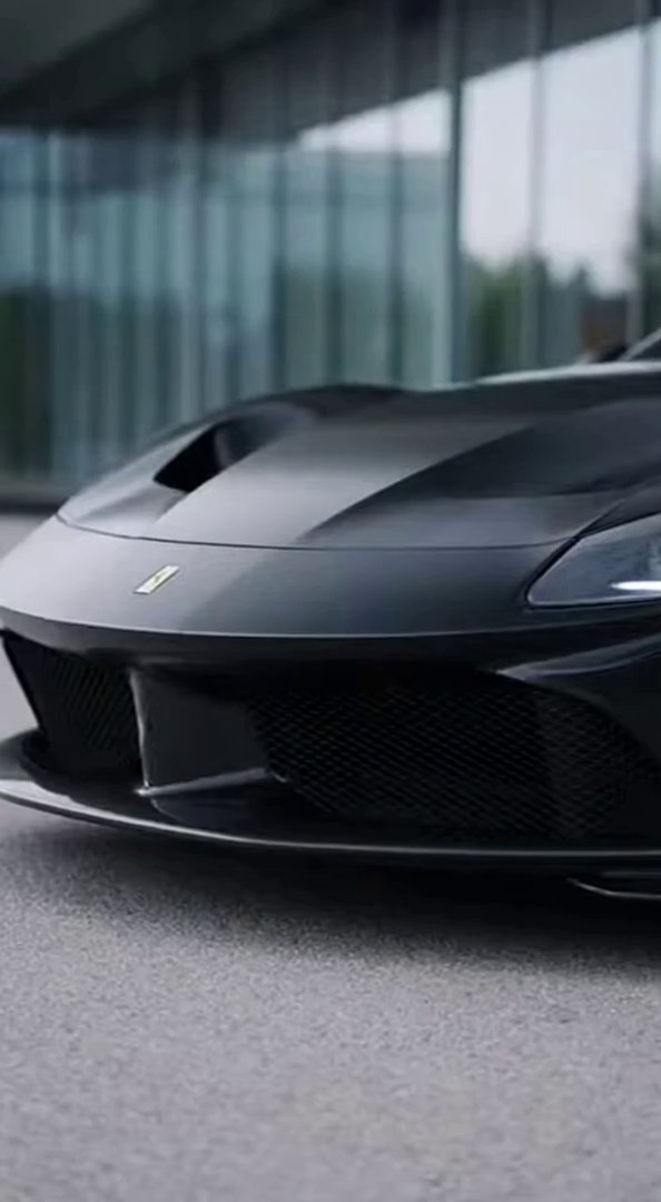 [Sora 2] « Créer une vidéo ultra-réaliste d’une supercar Ferrari noire, filmée à 60 fps, style showroom premi... - Veo 3 AI video prompt thumbnail