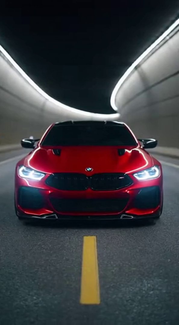 [Sora 2] “Cinematic shot of a glossy red BMW M8 inside a modern tunnel at night.
Start with a clean frontal ... - Veo 3 AI video prompt thumbnail