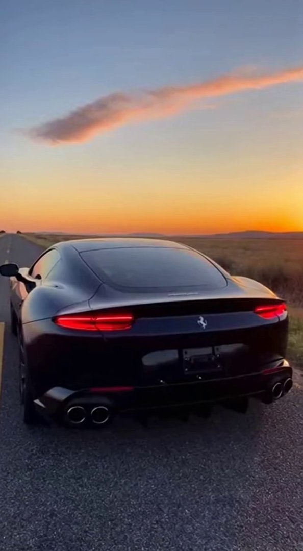 [Sora 2] **« Vidéo ultra réaliste style TikTok viral : une Ferrari Roma 2025 noire filmée de l’arrière sur un... - Veo 3 AI video prompt thumbnail