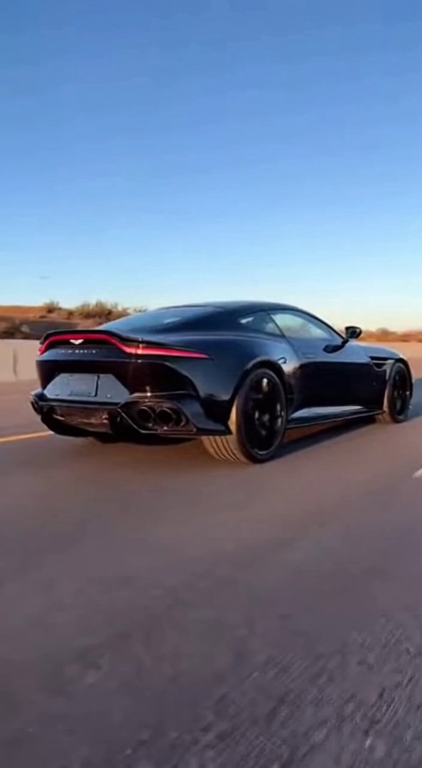 [Sora 2] Vidéo cinématographique ultra hyper réaliste d’une Aston Martin DBS / DB12 noire, véhicule réel, pro... - Veo 3 AI video prompt thumbnail