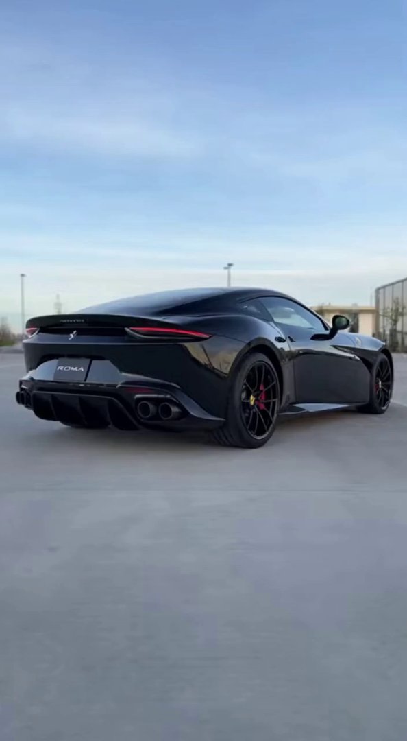 [Sora 2] « Vidéo hyper réaliste en 4K d’une Ferrari Roma 2025 noire métallisée, immobile dans un parking exté... - Veo 3 AI video prompt thumbnail