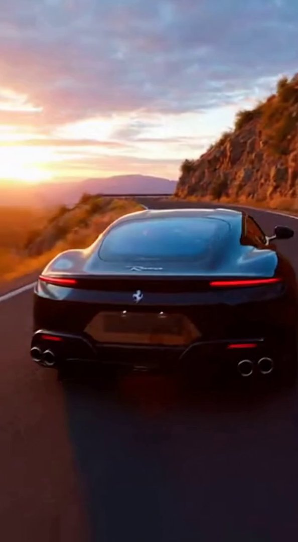 [Sora 2] « Ferrari Roma 2025 noire, ultra réaliste, filmée depuis l’arrière sur une route de montagne au couc... - Veo 3 AI video prompt thumbnail