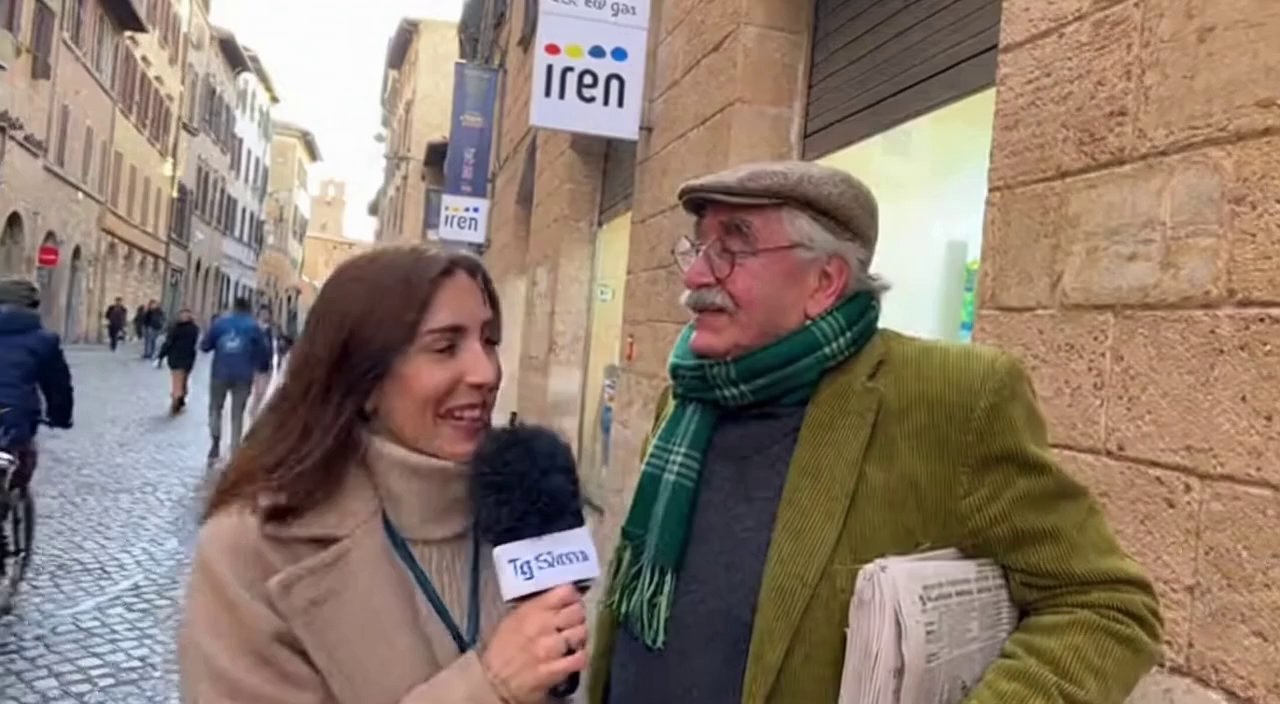 [Sora 2] C è la giornalista che ferma un signore anziano fuori al negozio Iren luce e gas  di Siena e gli chi... - Veo 3 AI video prompt thumbnail