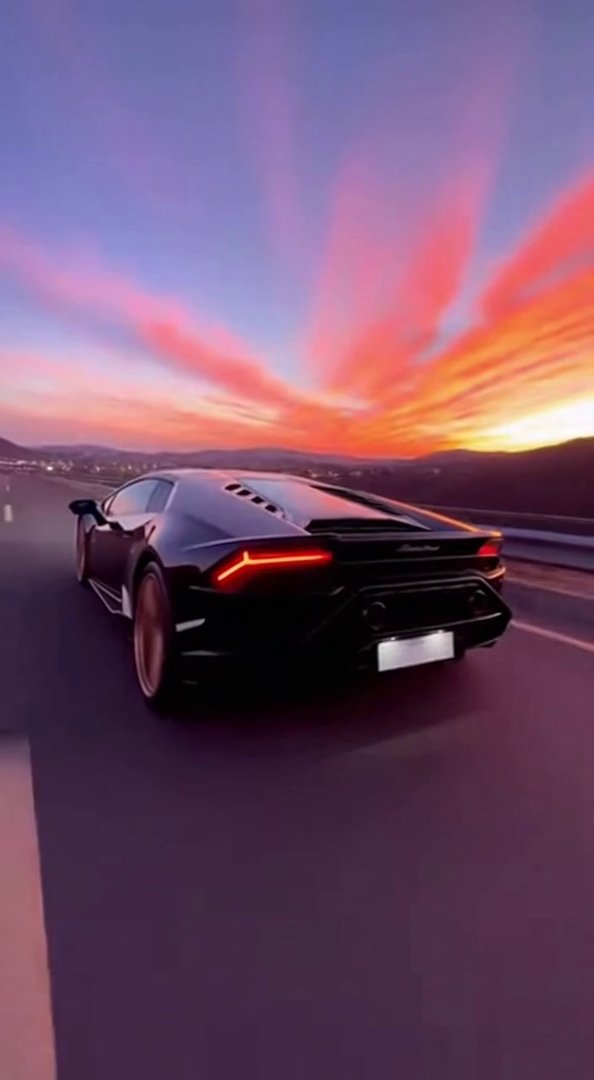 [Sora 2] « Vidéo ultra réaliste d’une Lamborghini Huracán noire roulant sur une grande route ouverte en haute... - Veo 3 AI video prompt thumbnail