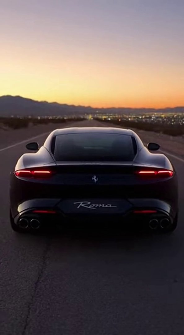 [Sora 2] **« Scène ultra réaliste d’une Ferrari Roma 2025 noire, filmée de l’extérieur depuis l’arrière sur u... - Veo 3 AI video prompt thumbnail