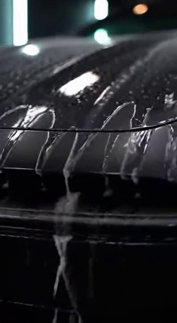 [Sora 2] Cinematic close-up of a luxury car during a professional car wash.
Clear water flows smoothly over ... - Veo 3 AI video prompt thumbnail