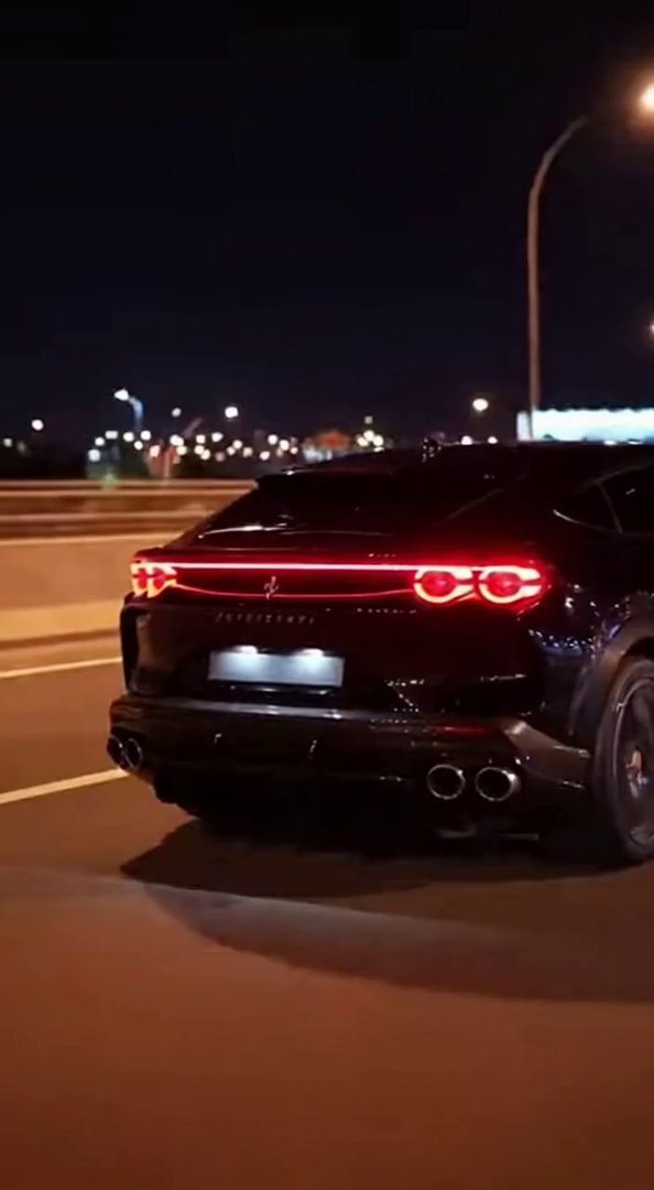 [Sora 2] Vidéo cinématographique ultra photoréaliste d’une Ferrari Purosangue noire, SUV sportif réel, propor... - Veo 3 AI video prompt thumbnail