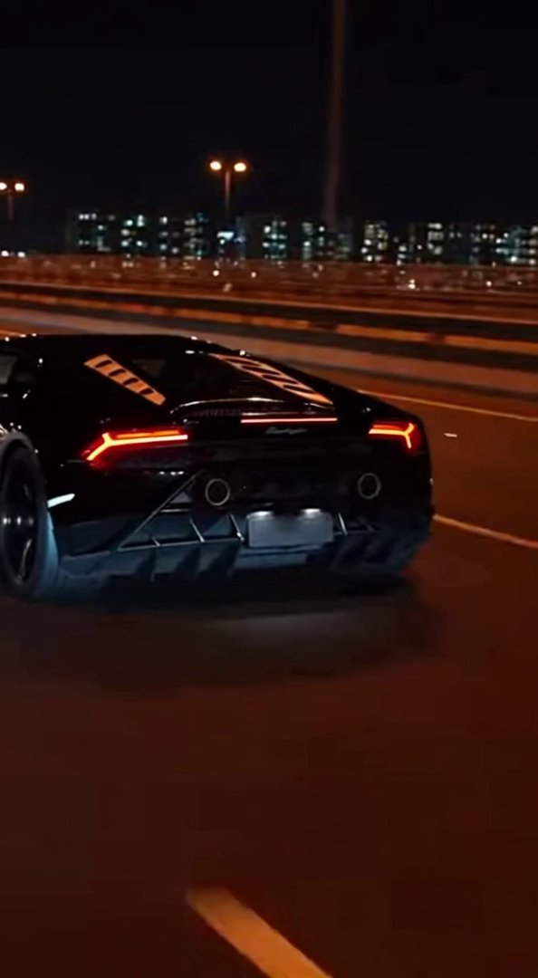 [Sora 2] Ultra-photorealistic cinematic night video of a real black Lamborghini Huracán
driving on a real ur... - Veo 3 AI video prompt thumbnail