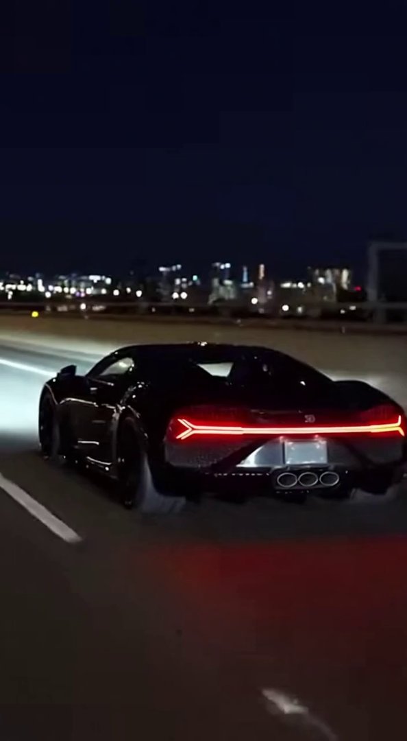 [Sora 2] Vidéo cinématographique ultra photoréaliste d’une Bugatti Mistral noire, proportions exactes, filmée... - Veo 3 AI video prompt thumbnail