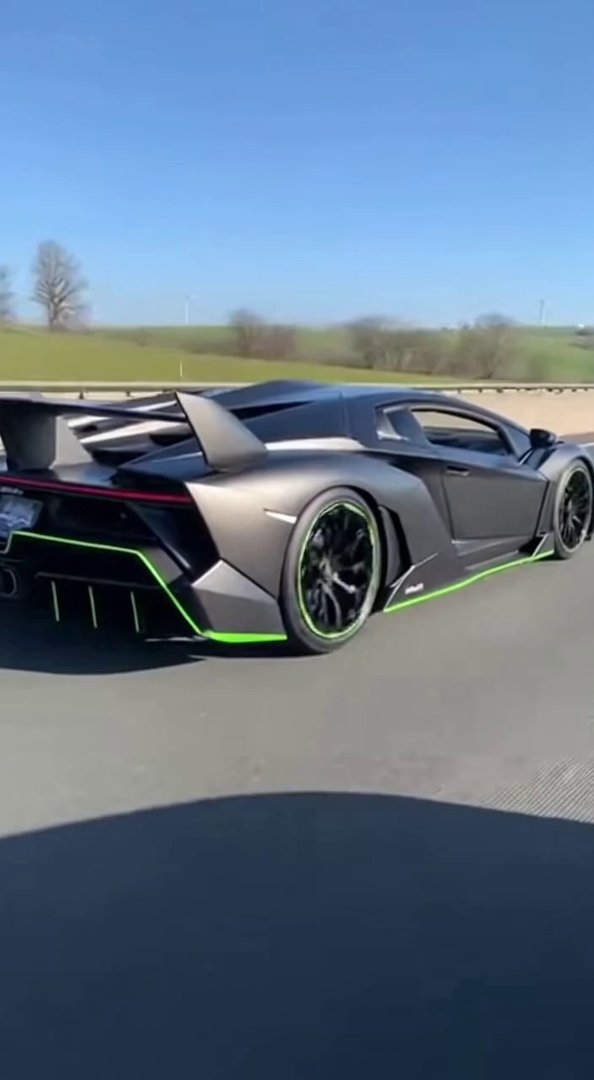 [Sora 2] Ultra realistic cinematic video of a black Lamborghini Veneno Roadster, matte carbon finish with gre...