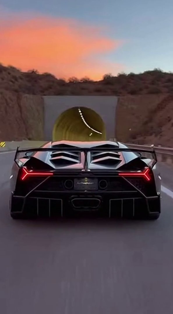 [Sora 2] Cinematic ultra realistic video of a black Lamborghini Veneno Roadster entering a long highway tunne...