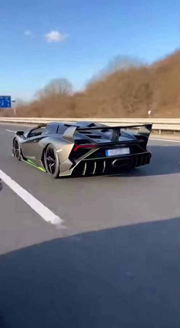[Sora 2] Ultra realistic cinematic video of a black Lamborghini Veneno Roadster, matte carbon finish with gre...